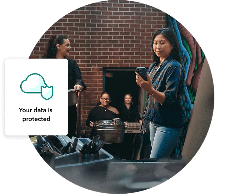 Two people collaborating at a laptop